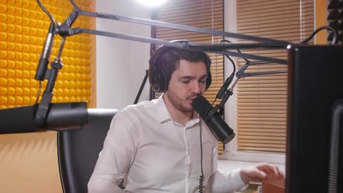 Man Podcasting in Recording Studio