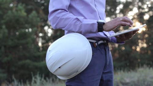 Building Engineer Works on the Tablet