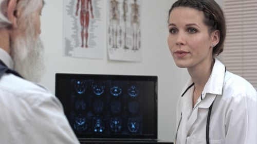 Doctors Discuss Brain Scan in Brightly Lit Office