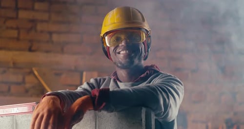 Cheerful Black Man on Construction Site