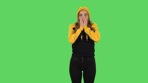 Modern Girl in Yellow Hat with Shocked Surprised Wow Face Expression. Green Screen
