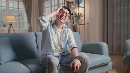 Man Plays Video Games at Home, Intense Expressions