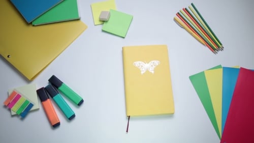 Stationery Still Life with Open Notebook and Idea