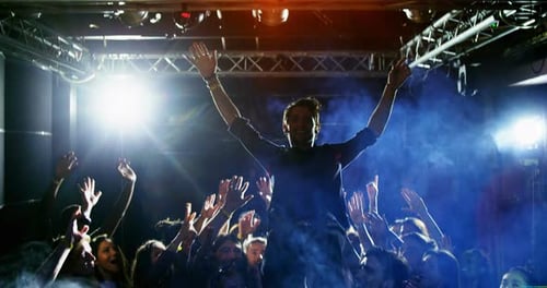 Performer Crowd Surfing at a Music Venue