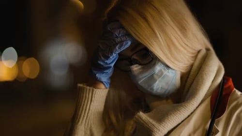 Close View Exhausted Doctor in Glasses and Medical Mask Looks Away