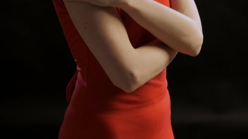 Stylish Woman Posing in Red Dress with Jewelry