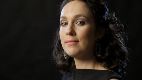 Glamorous Woman Posing with Elegance on Black Background