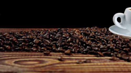 Close Up of Coffee Beans with Coffee Cup