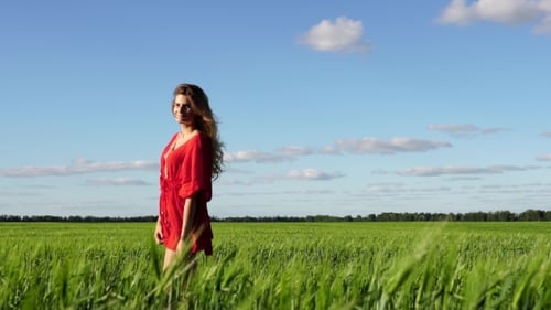 Happy Woman Enjoying Nature Beautiful Blonde Posing On Field. Freedom Concept.