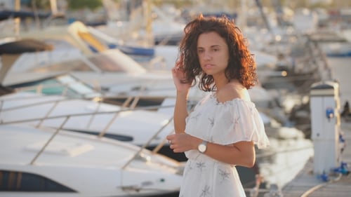 Beautiful Woman Thinking About Life on a Pier on a Summer Day Thinking About Life