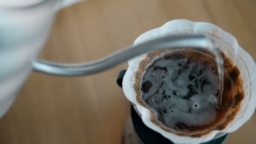 Pouring Hot Water into Coffee Filter with Grounds