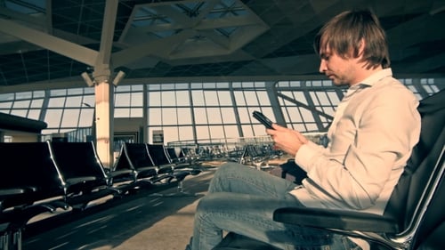 Handsome Smiling Man Holding Tablet And Working At The Airport, Technology, Travel And Modern Life