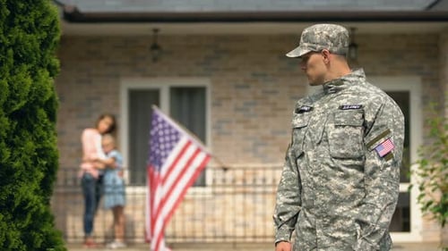 Soldier Home with Family in Suburban Neighborhood