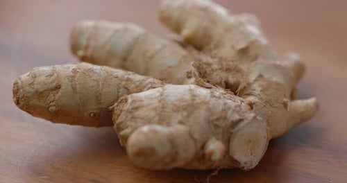 Close-up of Knobby Ginger Root on Wood Table