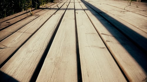 Wooden Reeds Among Construction On The River For Walking