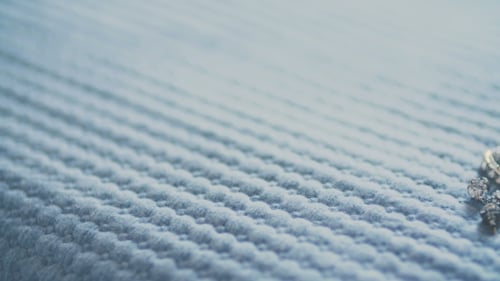 Rhinestone Bracelet on Light Blue Knit Background