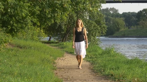 Young Skinny Girl Goes On a Footpath In The Forest