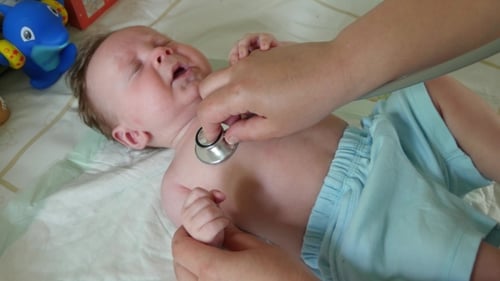 Baby Getting Checkup with Stethoscope