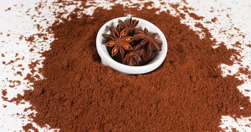 Aromatic Star Anise Spices on Ground Coffee