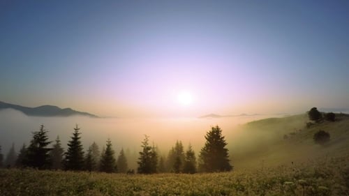 Ethereal Fog and Stunning Sunrise Over Mountain Valley