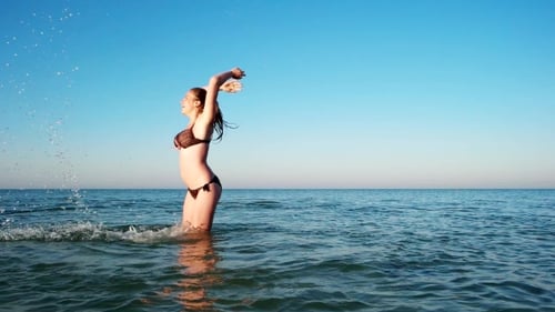 Cheerful, Sexy Girl Bathing In The Sea.