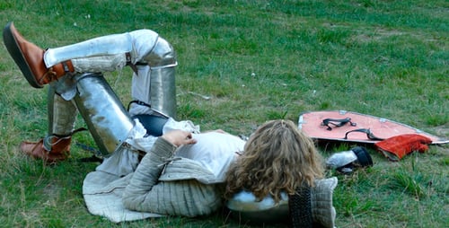 Person in Armor Lying on Grass