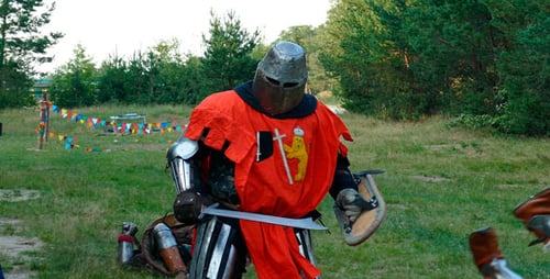 Medieval Knights Engage in Sword Fighting Reenactment