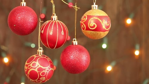 Festive Red and Gold Christmas Ornaments with Twinkling Lights