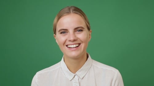 Blonde Woman Smiling on Green Screen Background