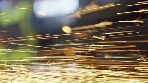 Circular Saw Cutting Metal with Flying Sparks