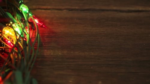 Flashing Garland On The Wooden Floor.