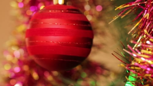 Close Up of Red Bauble on Christmas Tree