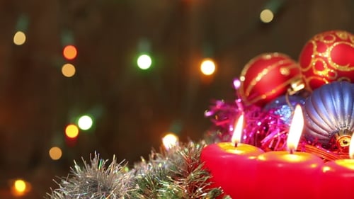 Festive Holiday Decorations with Burning Candles and Ornaments