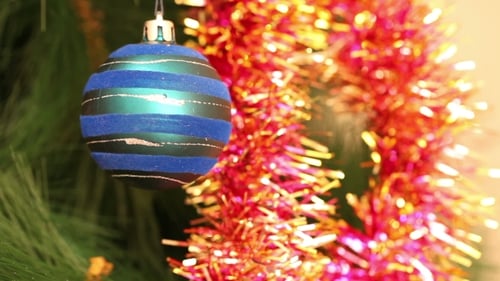 Christmas Tree with Blue Ornament and Pink Tinsel