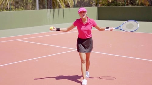 Athletic Woman Talking and Walking on Tennis Court