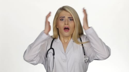 Frightened Woman Doctor Reacts to Bad News