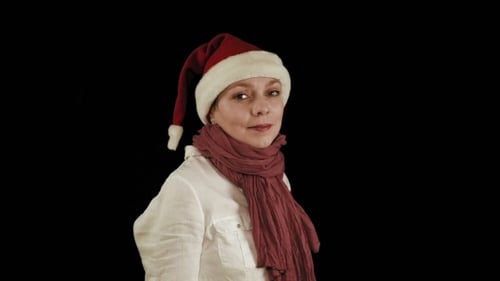 Smiling Woman Wearing a Santa Hat and Scarf