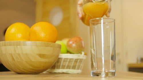 Orange Juice Pouring Into Glass