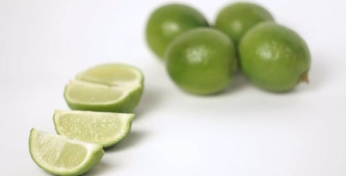 Slicing Fresh Green Limes for Cooking