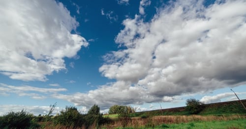 Clouds Over the Green Field