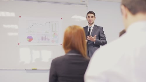 Business Presentation with Graphs in a Modern Office