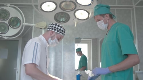 Healthcare Workers Preparing in Hospital Operating Room