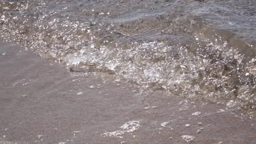Waves On The Beach With Pebbles. .