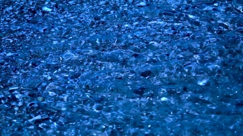 Ripples Of Clear Night Sea Water Reflections Over Sands At He Bottom. .