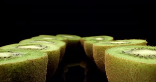 fly betwen kiwi fruits close up mega macro