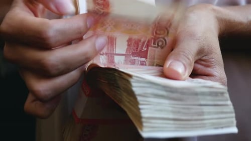 A Female Hands Counting Stack Of Russian Rubles