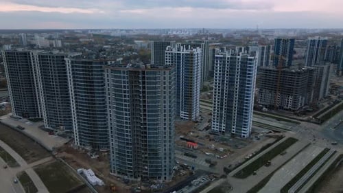Construction of modern multi-storey buildings. Construction of a new city block.