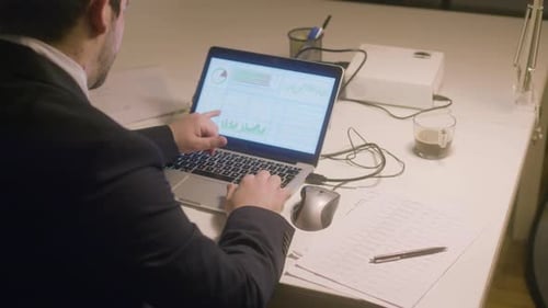 Caucasian Bearded Man Working in Office While Typing on Laptop