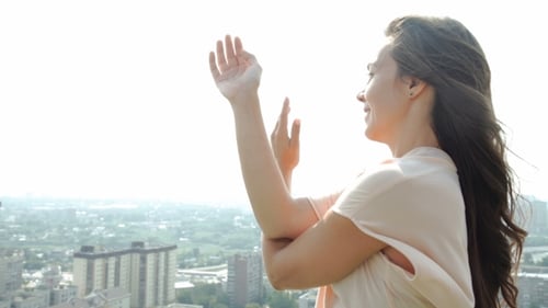 Beautiful Woman Doing a Yoga Exercise On He Rooftop Of a Skyscraper. 20S.