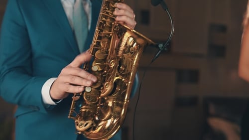 Saxophonist In Blue Suit Play Jazz On Golden Saxophone On Stage. Elegance.